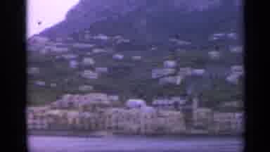 Italy (1962): Ancient Buildings Houses With Grass And Mountains Surrounding The