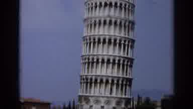 Italy (1962): People Walk Around Near The Base Of The Leaning Tower Of Pisa In