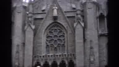 Italy (1962): Camera Pans Around The Large Brown Stone Church Building And The