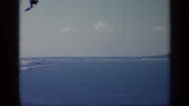 Italy (1962): Blue Ocean Water And Brown Tug Boat On A Bright Sunny Day