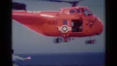 Italy (1962): Red Helicopter With Star Lands On Aircraft Carrier With Two Men
