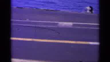 Greece (1963): Military Jet Airplane On Deck Of Aircraft Carrier Camera Pans Down