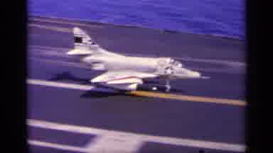 Greece (1963): White Plane Lands On Aircraft Carrier On A Bright Sunny Day