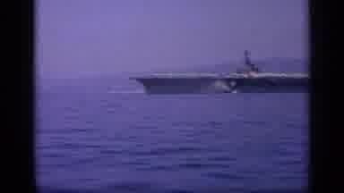 Greece (1963): Aircraft Carrier Ship Sitting In A Bay With Coastline In The