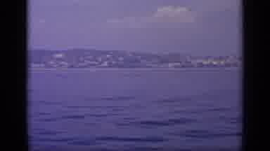 Greece (1963): Sweeping A Large City Next To The Ocean While Riding In A Boat