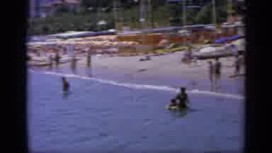 GREECE-1963: People Running And Swimming On A Summer Day At The Beach