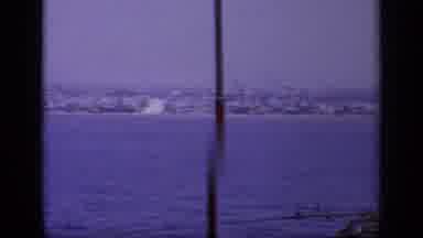 Greece (1963): Moving Blue Water Next To Shore With Homes And Buildings