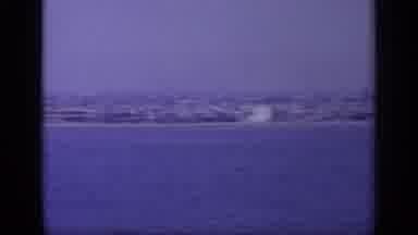 Greece (1963): Panning Shot Of An Ocean And A City Next To Water