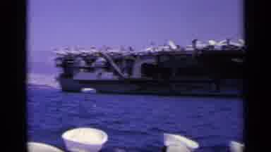 Greece (1963): Sailors Look Over A Battleship Replete With Warplanes On Deck From