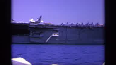 Greece (1963): Sailors On Deck As They Sail Passed A Nearby Aircraft Carrier