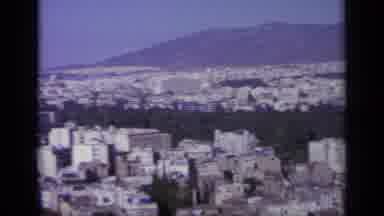 Greece (1963): City Skyline And Buildings In The Valley Of A Mountain Panning
