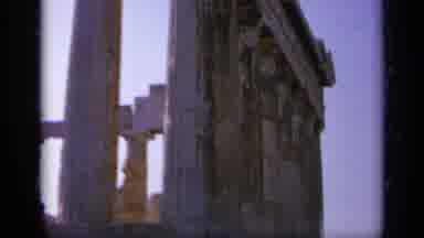 Greece (1963): Low Angle And Sweeping A Tall Ancient Structure In A Courtyard