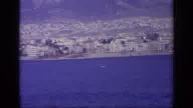 Greece (1963): Men Walking Through Parked Aviations And There's A Lake