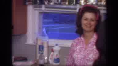 California USA (1968): Three Women And Baby In High Chair In Kitchen Food Is On