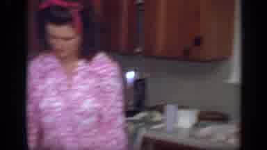 California USA (1968): Family Sitting Around The Table Eating Chicken And Talking