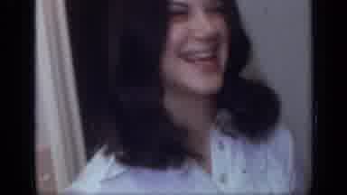 California USA (1968): Young Lady Laughs Then Old Lady Sits And Waves Then
