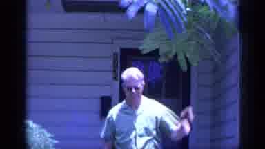 Florida USA (1968): Man Walking Out Of House Pointing To Something In The Distance