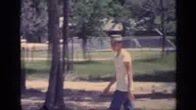 Florida USA (1968): Teen In Hat Walks By Young Man With Baseball Glove Towards A