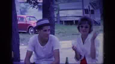 Florida USA (1968): Teenage Boy And Girl Sit Then Girl Talks Then Lady Walks