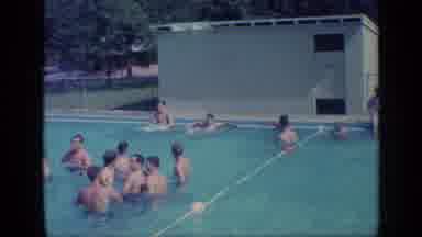 Florida USA (1968): Group Of Boys And Men Swimming In The Clear Waters Of A Public