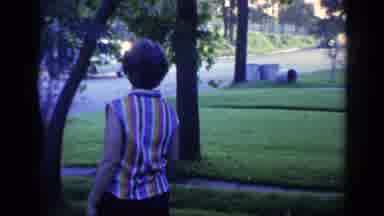 Florida USA (1968): Woman Walking Out In Front Yard Of House Smiling