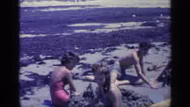Florida USA (1968): Young People At The Beach Playing On The Sand While Waving