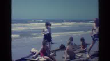 Florida USA (1968): Man Moves Away From Family Close To Ocean Then Two Men Stand