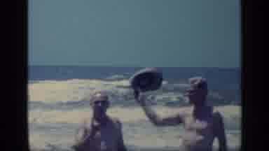Florida USA (1968): Man On Right Waves Hat Then Other Man Opens Arms Then First