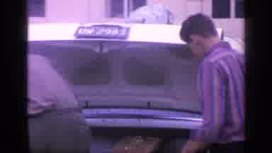 Florida USA (1968): Men Packing Luggage Into Car