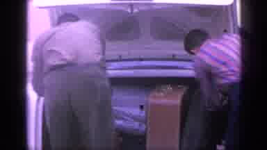 Florida USA (1968): Men Loading Luggage Into The Trunk Of A Car Circa 1950'S