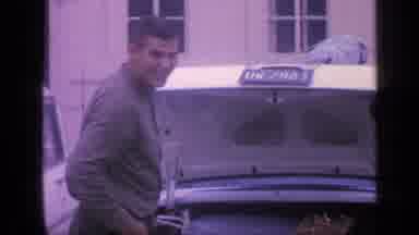 Florida USA (1968): Two Men Are Preparing To Go On A Trip By Stuffing Their Car's