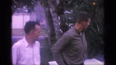 Florida USA (1968): Middle Aged Man Rubs Hands Together As He And Younger