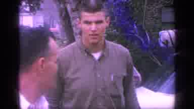 Florida USA (1968): Man Wearing Tan Shirt Walks Away From White Car On A Clear Day