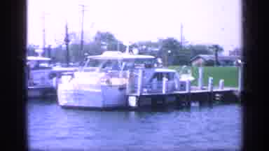 Florida USA (1968): Group Of Men And Boats Docked On A Lake