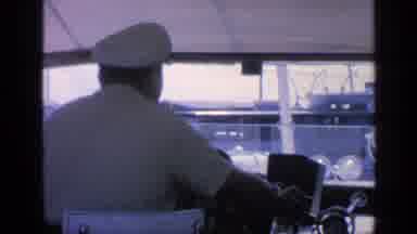 Florida USA (1968): A Captain Of A Yacht Talking While Driving With His Guests In