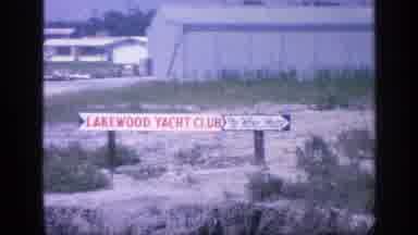 Florida USA (1968): Woman Talking While Riding On A Boat With Other Boats And Sign