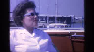 Florida USA (1968): Women Sitting In Boat With Wind Blowing On Her Hair As She