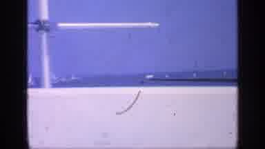 Florida USA (1968): Girl On Fishing Boat Pushing Back Hair From Sea Breeze On