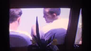 Florida USA (1968): Two Men Flirting Outside A Window Sitting And Looking Back