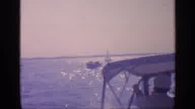 Florida USA (1968): Boat Captain Driving His Boat On The Ocean During A Sunny