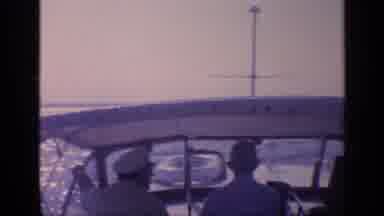 Florida USA (1968): Three Men Driving A Small Boat In The Sea And Woman Resting