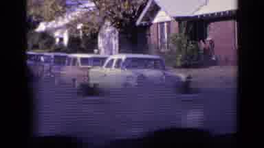 Florida USA (1968): Cars Are Parked And People Are Standing And Taking