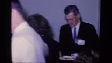 Florida USA (1968): People Gather In Room And Jockey For Position Where Woman Has