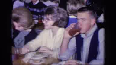 FLORIDA USA-1968: Panning View of Young Adults Eating and Drinking in a Crowded Diner