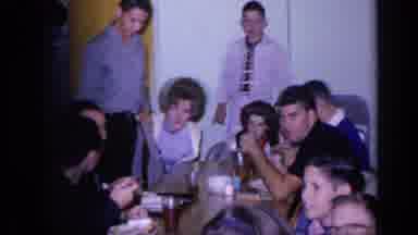 Florida USA (1968): Group Of Young People Sitting Down At A Table Inside