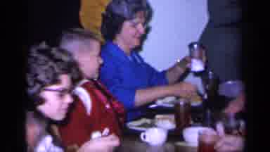 Florida USA (1968): Family Lunch And A Lady Putting Something That Looks Like