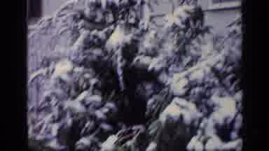 California USA (1969): Kid In Snowy Winter Weather Wearing A Winter Coat And Hat