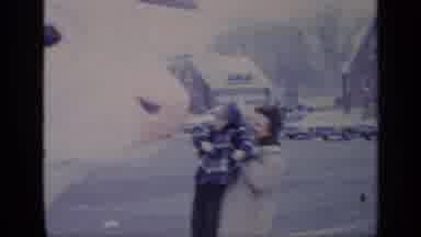 California USA (1969): Woman And Child Amazed At Giant Cow On The Street