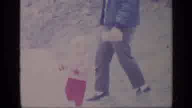 California USA (1969): Child Running About To Get In The Car With Father