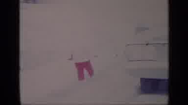 California USA (1969): Kid Playing On Sidewalk Covered In Snow
